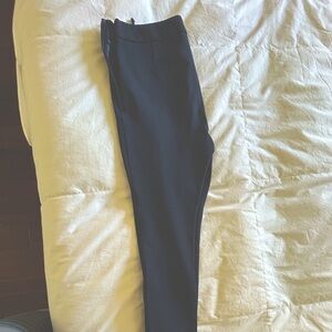 Valentino skinny stretch pants with zipperr accents at the bottom.